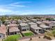 Aerial view of backyards featuring pavers, artificial turf, landscaping, trampoline, and privacy fence at 4527 E Gagarinite Ln, San Tan Valley, AZ 85143