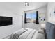Well-furnished bedroom featuring a bed, closet, TV, and a bright window at 4527 E Gagarinite Ln, San Tan Valley, AZ 85143