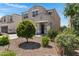 Charming two-story home featuring a covered front porch and low-maintenance desert landscaping at 4527 E Gagarinite Ln, San Tan Valley, AZ 85143