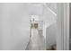 Bright hallway showcasing tile flooring, a staircase, and a glimpse into the backyard and living space at 4527 E Gagarinite Ln, San Tan Valley, AZ 85143