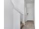 Upstairs hallway showcasing tile flooring leading to a white interior door at 4527 E Gagarinite Ln, San Tan Valley, AZ 85143