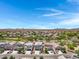 Scenic street view of new homes boasting desert landscaping, and mountain views at 4527 E Gagarinite Ln, San Tan Valley, AZ 85143