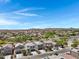 Scenic street view of new homes boasting desert landscaping, and mountain views at 4527 E Gagarinite Ln, San Tan Valley, AZ 85143