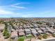 Scenic street view of new homes boasting desert landscaping, and mountain views at 4527 E Gagarinite Ln, San Tan Valley, AZ 85143