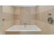 Tiled bathtub offers a relaxing and private bathing experience, perfect for unwinding after a long day at 4747 N Scottsdale Rd # 4009, Scottsdale, AZ 85251