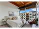 Serene bedroom with a comfortable bed, stylish furnishings, and views of the cityscape at 4747 N Scottsdale Rd # 4009, Scottsdale, AZ 85251
