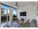 Stylish living room with modern fireplace, comfortable leather sofa, and scenic views from large windows at 4747 N Scottsdale Rd # 4009, Scottsdale, AZ 85251