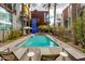 Refreshing pool is surrounded by palm trees and modern buildings, perfect for relaxing at 4747 N Scottsdale Rd # 4009, Scottsdale, AZ 85251