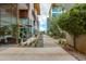 Walkway between buildings features greenery and places to sit, creating a pleasant outdoor environment at 4747 N Scottsdale Rd # 4009, Scottsdale, AZ 85251