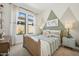Inviting bedroom with patterned accent wall, soft lighting, and a serene atmosphere at 477 E Aurora Dr, San Tan Valley, AZ 85140