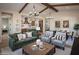Open living space with vaulted ceilings, exposed beams, and seamless flow to the kitchen and dining areas at 477 E Aurora Dr, San Tan Valley, AZ 85140