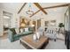 Inviting living room with vaulted ceilings, exposed beams, and stylish furniture at 477 E Aurora Dr, San Tan Valley, AZ 85140