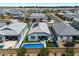 Aerial view of a backyard with a pool, spa, and solar panels on the roof at 5341 W Alta Mesa Ave, Laveen, AZ 85339