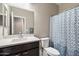 Bathroom with modern sink, toilet and custom blue shower curtain at 5341 W Alta Mesa Ave, Laveen, AZ 85339