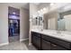Bathroom featuring a double vanity, walk-in closet, and neutral paint at 5341 W Alta Mesa Ave, Laveen, AZ 85339