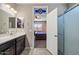 Bathroom featuring a single vanity and open view into the bedroom at 5341 W Alta Mesa Ave, Laveen, AZ 85339