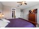 Bedroom featuring a ceiling fan and an open view into the hallway at 5341 W Alta Mesa Ave, Laveen, AZ 85339