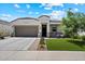 Charming single-story home with a well-manicured lawn and covered patio area at 5341 W Alta Mesa Ave, Laveen, AZ 85339