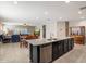 Open-concept kitchen with stainless steel appliances and an adjacent dining and living area at 5341 W Alta Mesa Ave, Laveen, AZ 85339