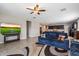A cozy living room showcasing an open layout to the kitchen and comfortable furnishings at 5341 W Alta Mesa Ave, Laveen, AZ 85339