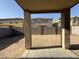 View of the backyard featuring block wall fencing and a covered patio at 6341 W Valencia Dr, Laveen, AZ 85339