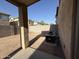 View of the backyard featuring a covered patio and HVAC systems at 6341 W Valencia Dr, Laveen, AZ 85339