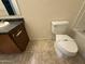 Sanitized bathroom features a single sink vanity, toilet, and shower-tub combo at 6341 W Valencia Dr, Laveen, AZ 85339