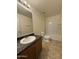 Clean bathroom featuring a vanity and tub-shower combination at 6341 W Valencia Dr, Laveen, AZ 85339