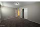 This bedroom features plush carpeting and an adjacent closet for practical storage at 6341 W Valencia Dr, Laveen, AZ 85339