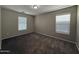 This bedroom is bathed in natural light, featuring plush carpeting and neutral walls at 6341 W Valencia Dr, Laveen, AZ 85339