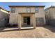 Exterior backyard view featuring sliding glass door access from the covered patio at 6341 W Valencia Dr, Laveen, AZ 85339