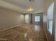 Inviting living room features neutral tones, tile flooring, and large windows with privacy blinds at 6341 W Valencia Dr, Laveen, AZ 85339