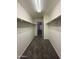 Bright walk-in closet featuring carpeted floors and rod and shelf organizers at 6341 W Valencia Dr, Laveen, AZ 85339