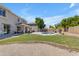 Large backyard with pool, grass, and brick patio at 7129 S Stadium Way, Gilbert, AZ 85298