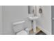 Powder room with sleek sink, toilet, and modern fixtures at 7129 S Stadium Way, Gilbert, AZ 85298