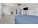 Spacious bedroom with ceiling fan, neutral carpet and ensuite bath at 7129 S Stadium Way, Gilbert, AZ 85298