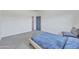 Well-lit bedroom with neutral carpet, and natural light at 7129 S Stadium Way, Gilbert, AZ 85298