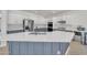 Spacious kitchen featuring a large island with white countertops, stainless appliances, and two-tone cabinets at 7129 S Stadium Way, Gilbert, AZ 85298