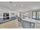 Bright and modern kitchen with stainless steel appliances and access to the backyard patio at 7129 S Stadium Way, Gilbert, AZ 85298