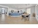 Spacious open-concept kitchen with white cabinets, stainless steel appliances, and a large center island at 7129 S Stadium Way, Gilbert, AZ 85298