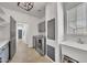 This laundry room features gray cabinets, stainless steel washer and dryer and a utility sink at 7129 S Stadium Way, Gilbert, AZ 85298