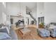 The living room features high ceilings, a piano, wood flooring, and ample seating at 7129 S Stadium Way, Gilbert, AZ 85298