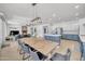 Open-concept kitchen and dining area with ample seating and a view into the living room at 7129 S Stadium Way, Gilbert, AZ 85298