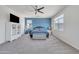 Spacious bedroom with blue accent wall, carpet floors, and ample natural light at 7129 S Stadium Way, Gilbert, AZ 85298