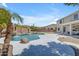 Inviting backyard pool with waterfall feature, surrounded by lush landscaping and a spacious patio for outdoor enjoyment at 7129 S Stadium Way, Gilbert, AZ 85298