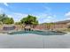 Pool with rock waterfall, palm trees, and stone landscaping at 7129 S Stadium Way, Gilbert, AZ 85298