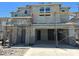 Exterior shot of a gray home under construction showcasing scaffolding and incomplete features at 7393 W Buckhorn Trl, Peoria, AZ 85383