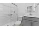 This bathroom features a glass enclosed shower, modern vanity and fixtures at 7434 S 75Th Dr, Laveen, AZ 85339