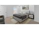 Bedroom with a large bed, neutral carpet, and bright white walls at 7434 S 75Th Dr, Laveen, AZ 85339