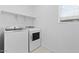 Well-lit laundry room featuring new, modern washer and dryer appliances at 7434 S 75Th Dr, Laveen, AZ 85339